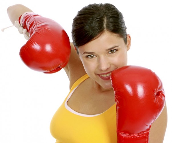 junge Frau in Sportdress beim Boxtraining, woman wearing boxing gloves